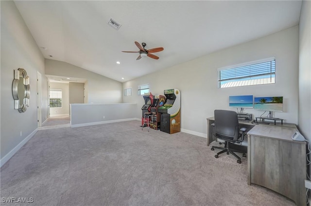 carpeted home office featuring ceiling fan and vaulted ceiling