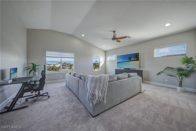 living room featuring ceiling fan, baseboards, vaulted ceiling, and light colored carpet