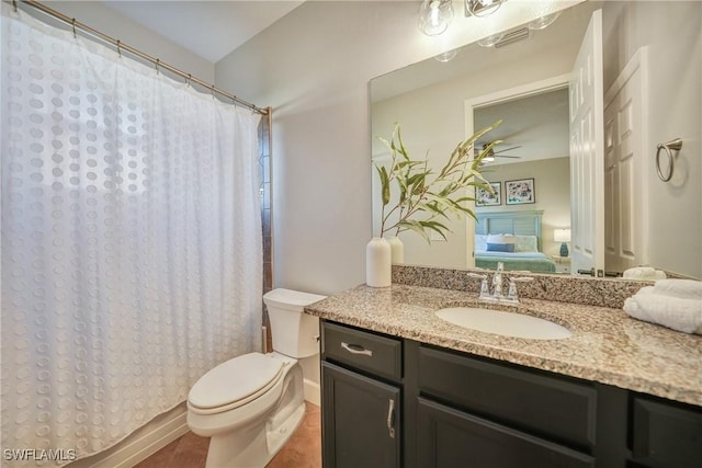 bathroom with vanity, toilet, and a shower with shower curtain