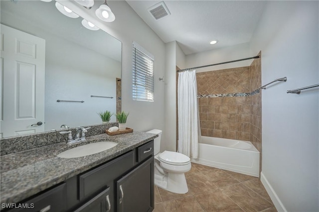 full bathroom featuring toilet, vanity, visible vents, tile patterned floors, and shower / bath combo