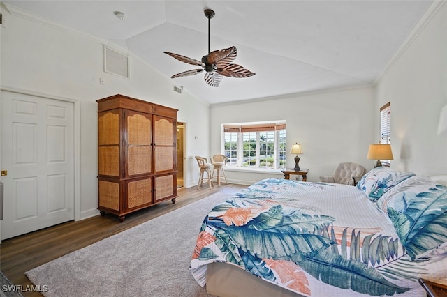 bedroom featuring ornamental molding, vaulted ceiling, ceiling fan, and dark hardwood / wood-style flooring