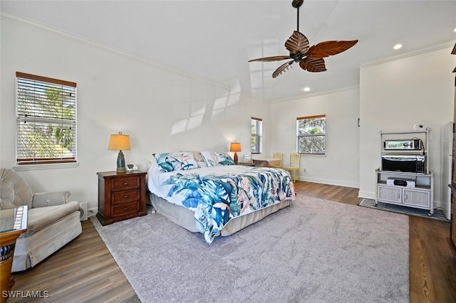 bedroom featuring dark wood-type flooring and ornamental molding