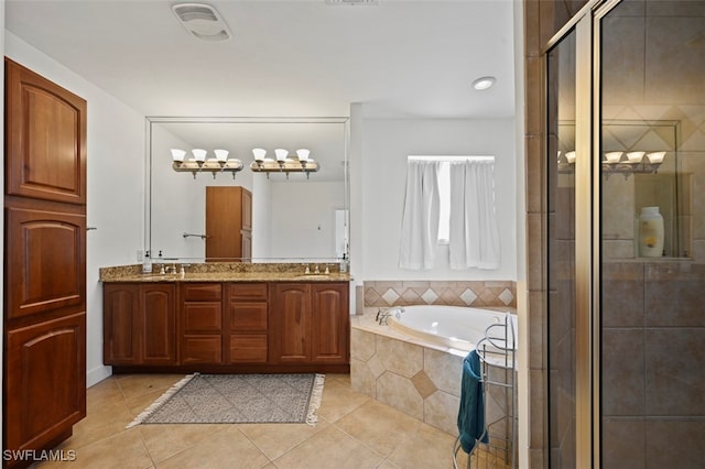 bathroom featuring vanity, shower with separate bathtub, and tile patterned flooring