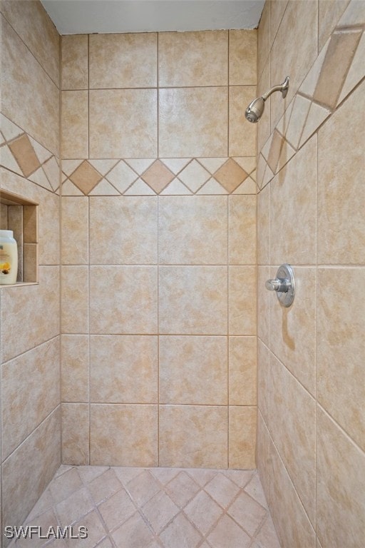 bathroom with a tile shower