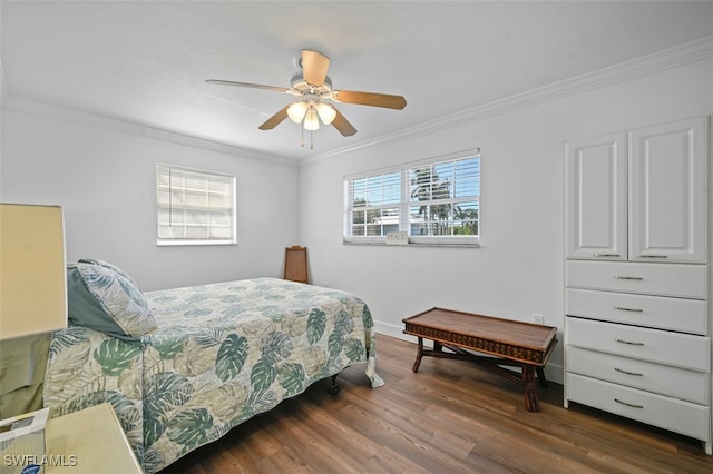 bedroom featuring dark wood-type flooring, ceiling fan, and ornamental molding