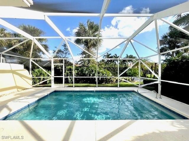 view of pool with a lanai