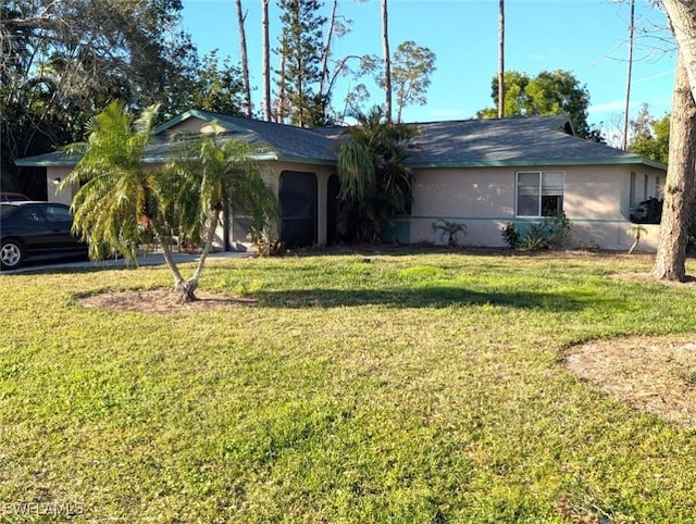 single story home with a front yard