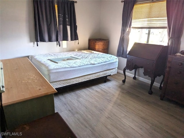 bedroom featuring wood-type flooring