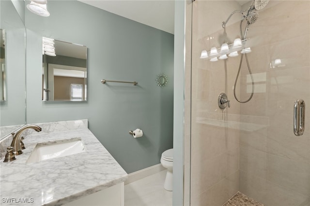 bathroom featuring vanity, tile patterned flooring, toilet, and walk in shower