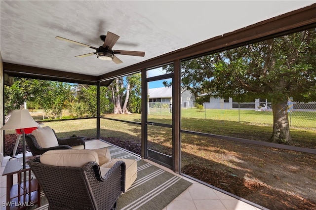 sunroom with ceiling fan