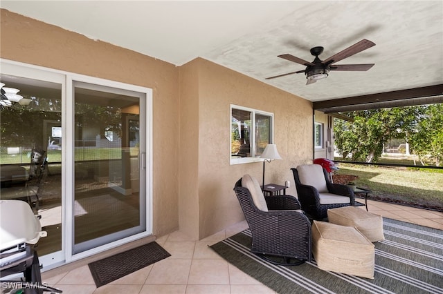 sunroom / solarium with ceiling fan