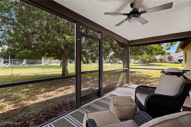 sunroom / solarium with ceiling fan