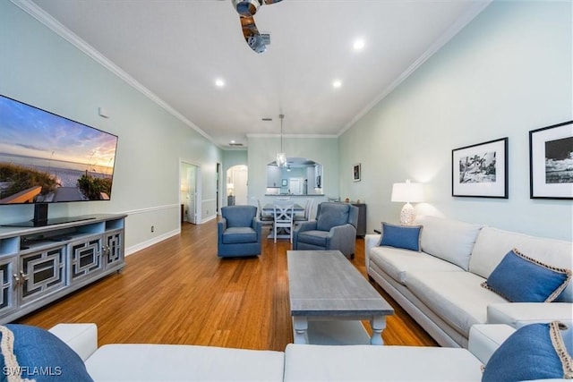 living room featuring crown molding and hardwood / wood-style floors