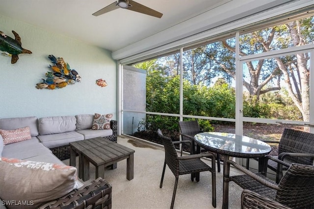 sunroom featuring ceiling fan