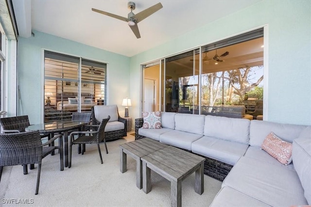 carpeted living room featuring ceiling fan