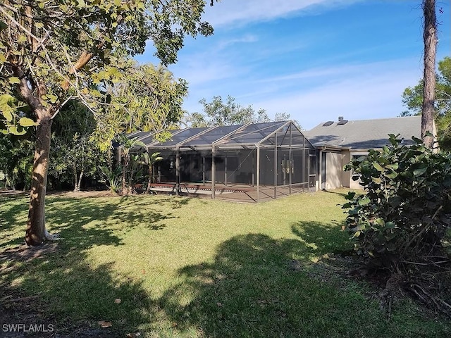 view of yard with a lanai