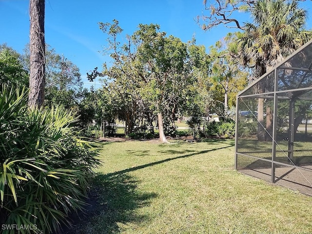 view of yard with a lanai