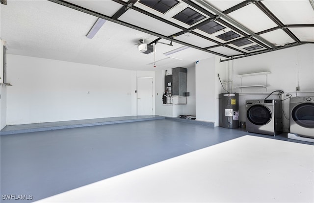 garage with washing machine and dryer, water heater, a garage door opener, and heating unit