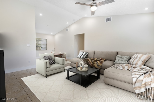 living room featuring vaulted ceiling, ceiling fan, and tile patterned flooring