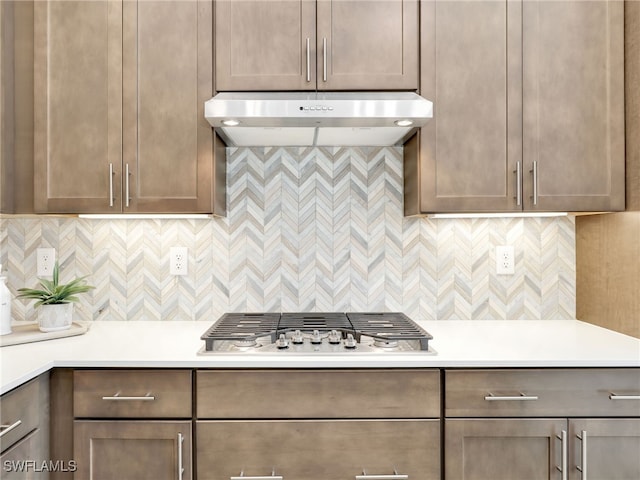 kitchen featuring backsplash and stainless steel gas stovetop