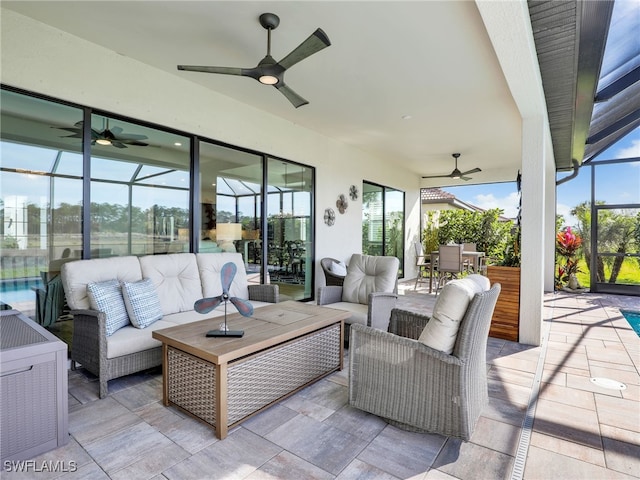 view of patio / terrace featuring outdoor lounge area, ceiling fan, and a lanai