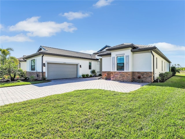 view of front of home featuring a garage and a front yard