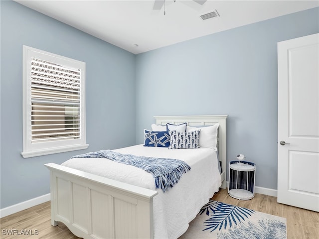 bedroom featuring ceiling fan and light hardwood / wood-style flooring