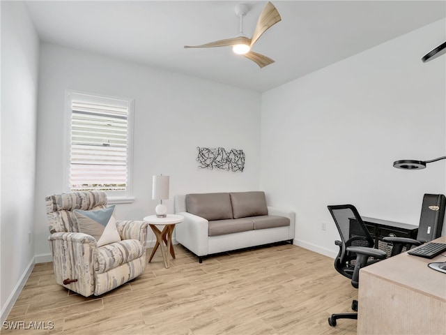 office area with light hardwood / wood-style floors and ceiling fan