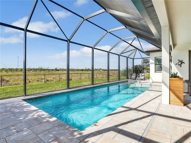 view of pool featuring a lanai and a patio area