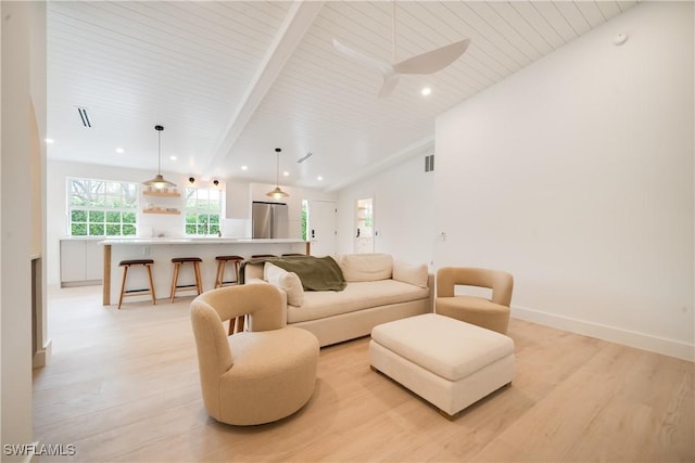 living area with light wood-type flooring, lofted ceiling with beams, baseboards, and recessed lighting