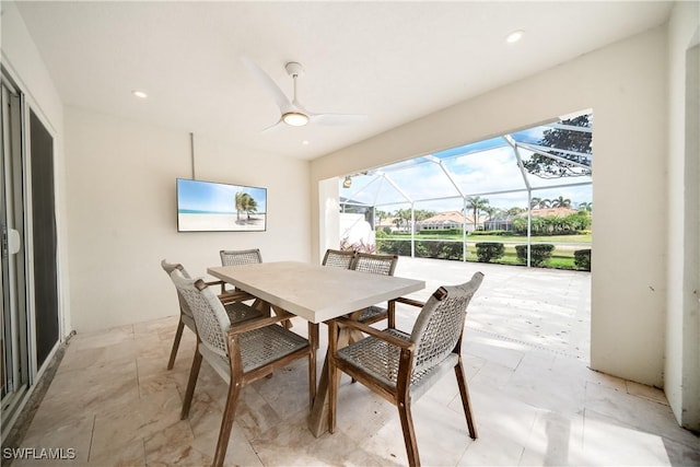 dining room with recessed lighting, a sunroom, and ceiling fan