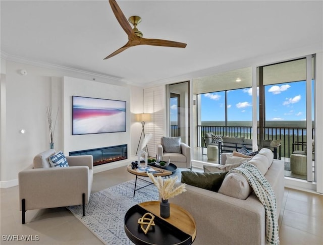 living room featuring floor to ceiling windows, ceiling fan, and crown molding