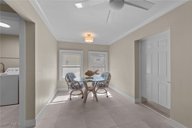 tiled dining space featuring washer / clothes dryer, ornamental molding, and ceiling fan