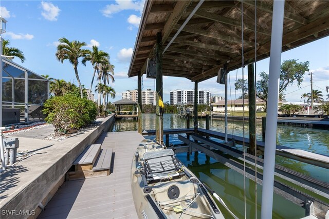 view of dock featuring a water view and a lanai