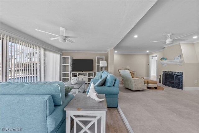 living room with crown molding and ceiling fan