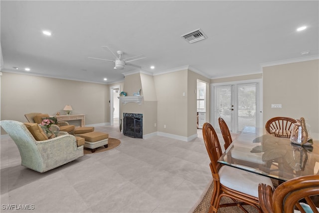 living room with ornamental molding and ceiling fan