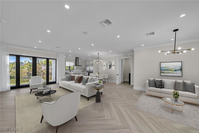 living room with french doors, a notable chandelier, ornamental molding, and light parquet floors