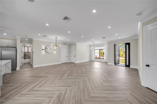 unfurnished living room with crown molding, light parquet floors, and a notable chandelier