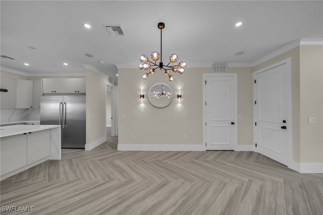 interior space with crown molding, a chandelier, and light parquet floors