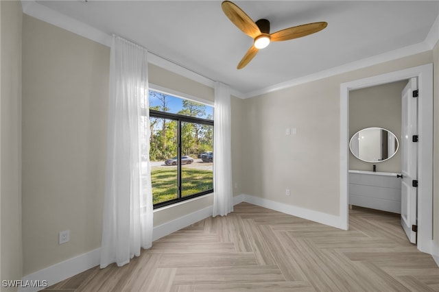 unfurnished bedroom featuring ceiling fan, crown molding, and light parquet flooring