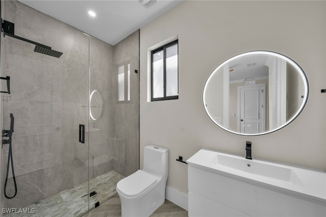 bathroom with vanity, an enclosed shower, and toilet