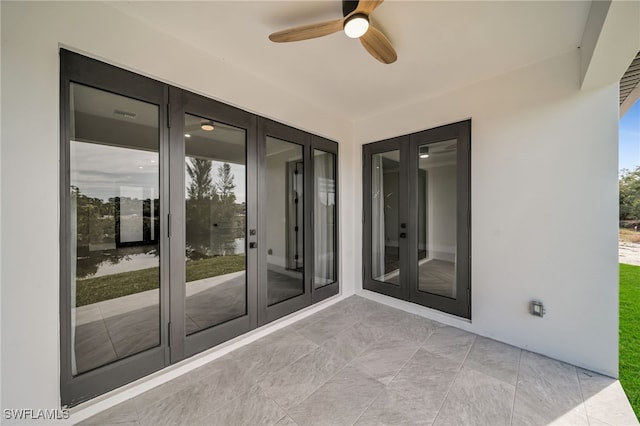 view of patio featuring french doors and ceiling fan