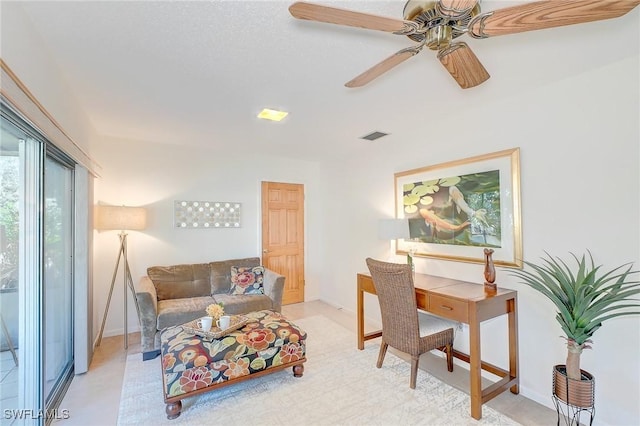 living room featuring ceiling fan