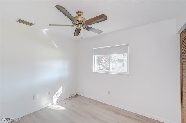 unfurnished room with ceiling fan and light hardwood / wood-style floors