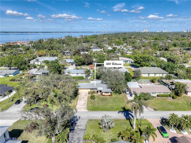 birds eye view of property featuring a water view and a residential view