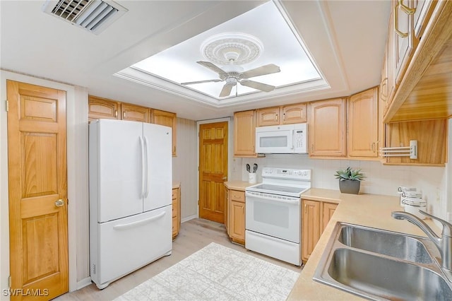 kitchen with sink, tasteful backsplash, white appliances, light brown cabinets, and ceiling fan