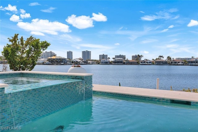 view of pool featuring a water view