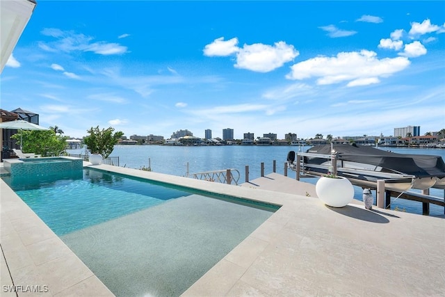 view of pool featuring a water view, an in ground hot tub, and a boat dock