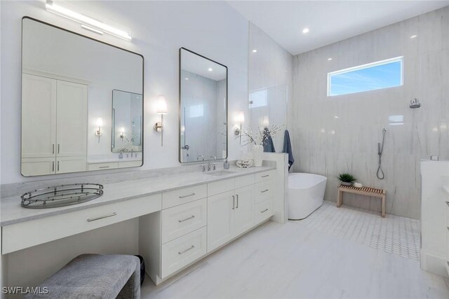 bathroom with vanity, tile walls, and plus walk in shower