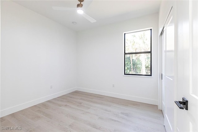 unfurnished room featuring ceiling fan and light hardwood / wood-style flooring